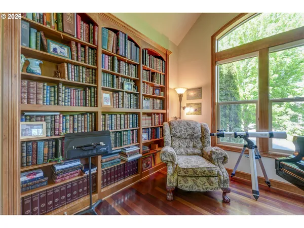 a reading room with furniture and book shelf