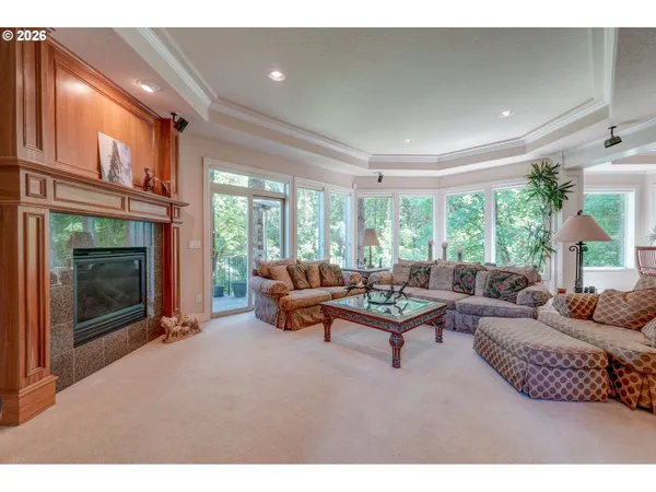 a living room with furniture a window and a fireplace