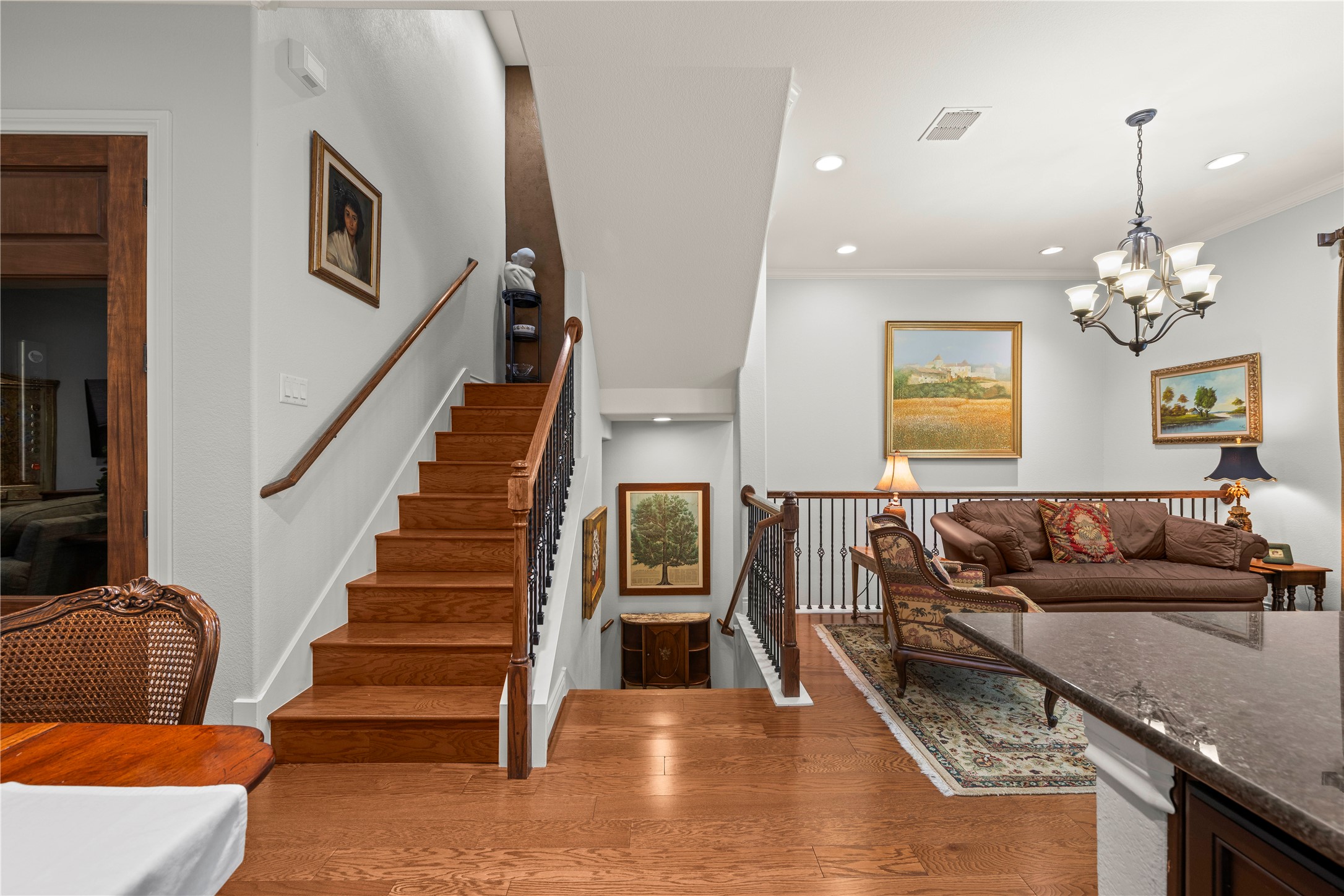 204 Adams Street Georgetown, TX 78628 - Photo 15 of 33 Rich hardwood floors flow through this multi-level home.