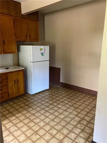 a kitchen with a refrigerator
