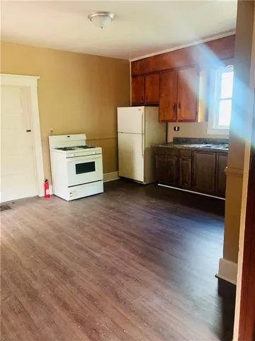 a kitchen with a white cabinets and white appliances