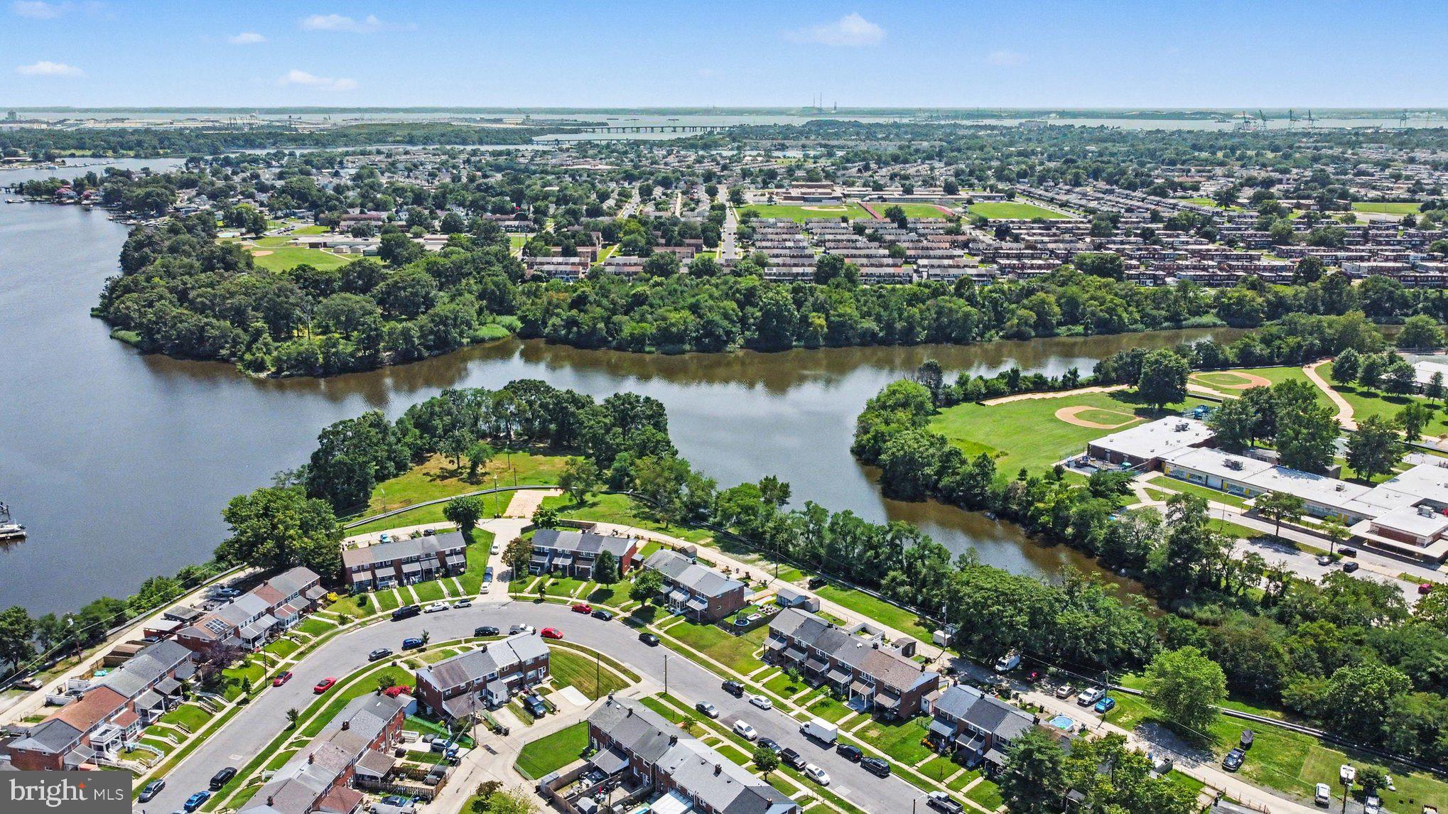 7729 Charlesmont Road Baltimore, MD 21222 - Photo 40 of 43 an aerial view of a city with lake view