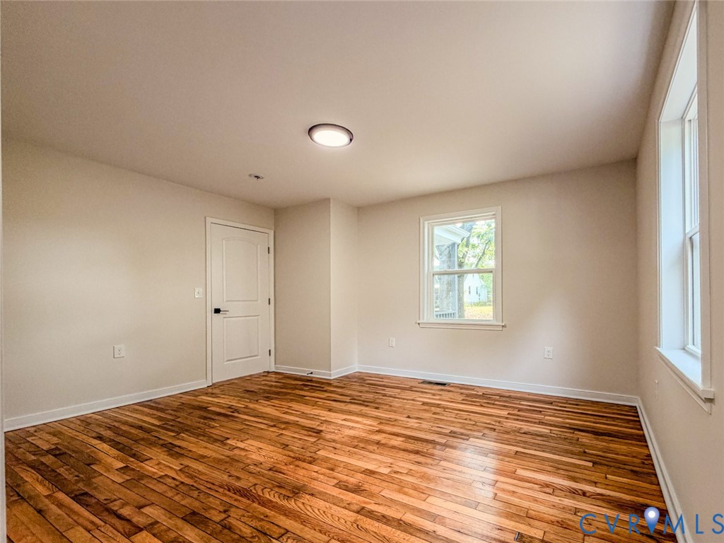 3409 Meadowbridge Road Richmond, VA 23222 - Photo 13 of 32 a view of a room with wooden floor and window
