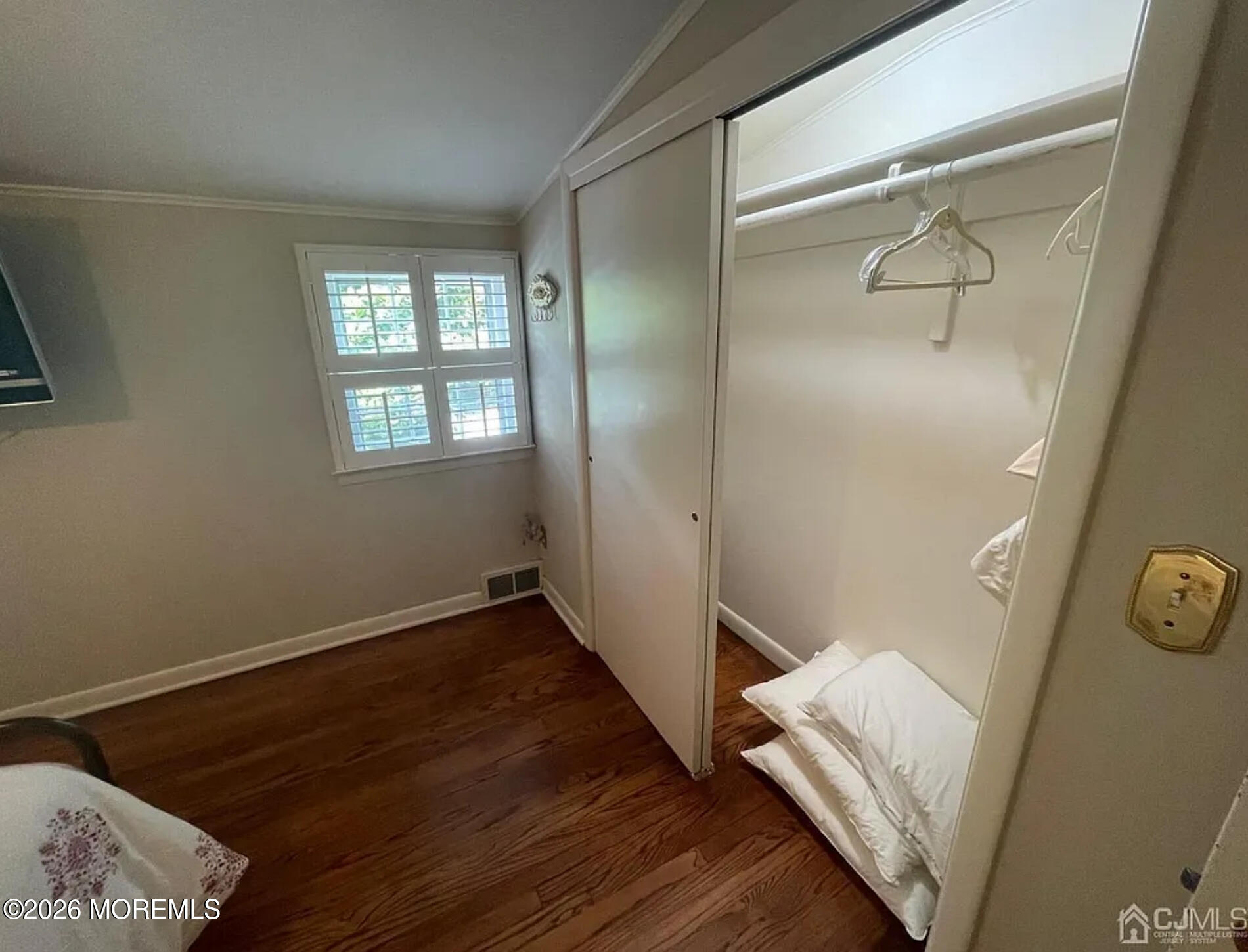 90 Minnesink Road Manasquan, NJ 08736 - Photo 17 of 30 a view of an empty room with wooden floor and a window