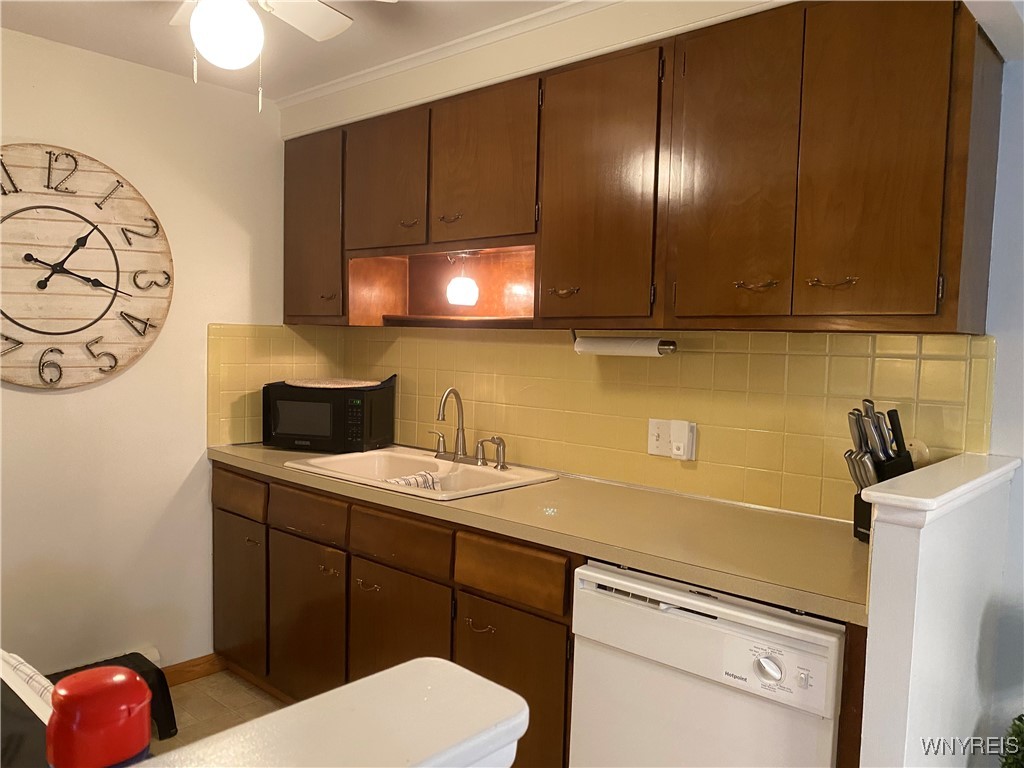 1172 Indian Church Road, Unit 12 West Seneca, NY 14224 - Photo 6 of 20 Galley style kitchen with newer dishwasher and ran