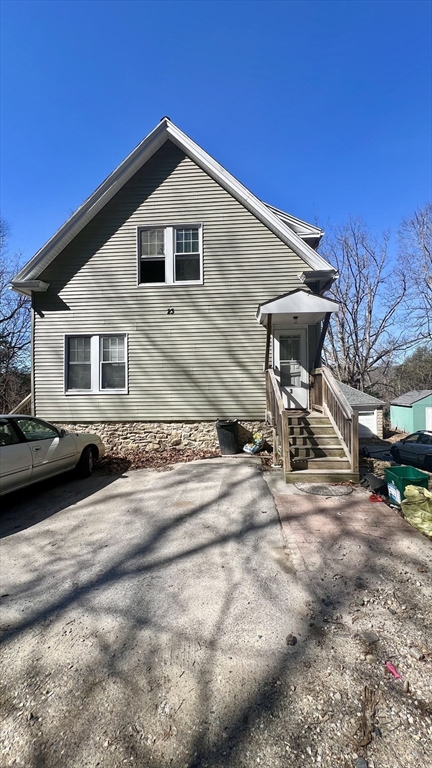 23 Firglade Street, Unit 3 Worcester, MA 01602 - Photo 11 of 12 a front view of a house with garden