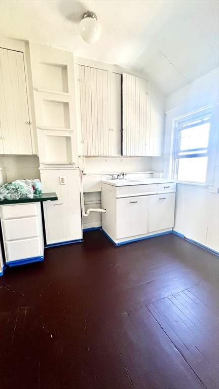 23 Firglade Street, Unit 3 Worcester, MA 01602 - Photo 3 of 12 a kitchen with a sink wooden floor and a window