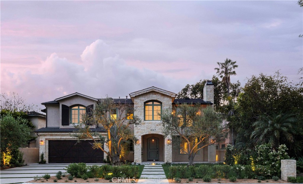 a front view of a house with a yard and balcony