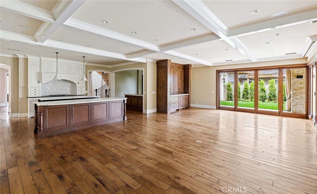 307 Pirate Road Newport Beach, CA 92663 - Photo 11 of 29 a view of an empty room with wooden floor and a window