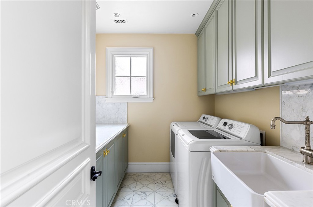 307 Pirate Road Newport Beach, CA 92663 - Photo 23 of 29 a utility room with dryer and washer
