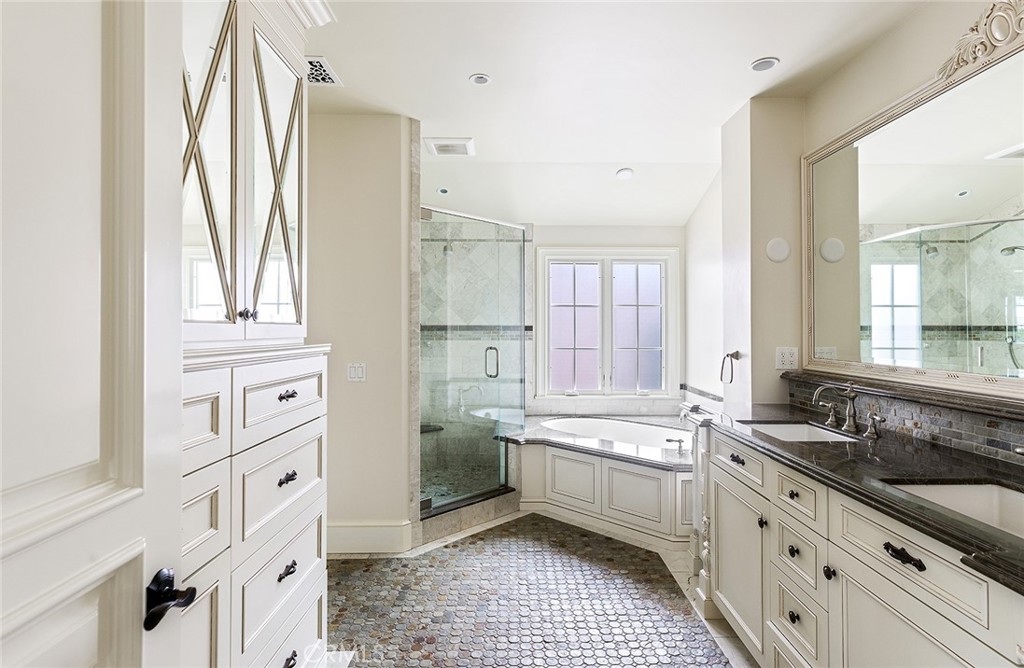 307 Pirate Road Newport Beach, CA 92663 - Photo 27 of 29 a large white kitchen with a sink a stove a refrigerator and white cabinets