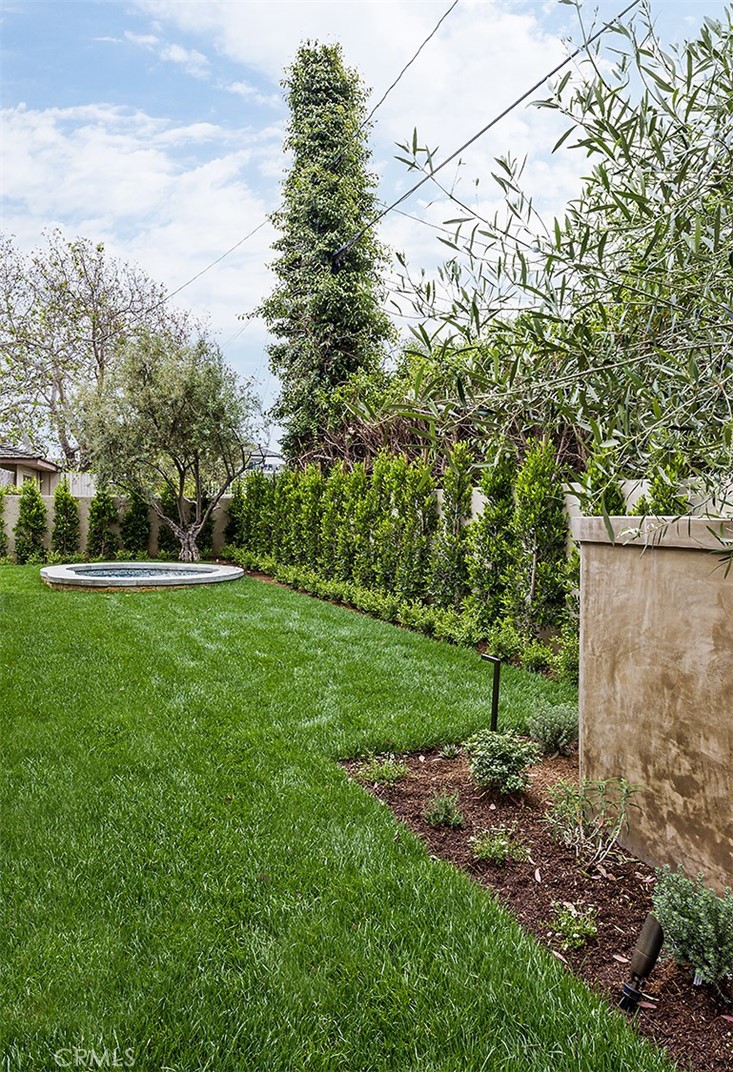 307 Pirate Road Newport Beach, CA 92663 - Photo 9 of 29 a view of a field of grass and trees