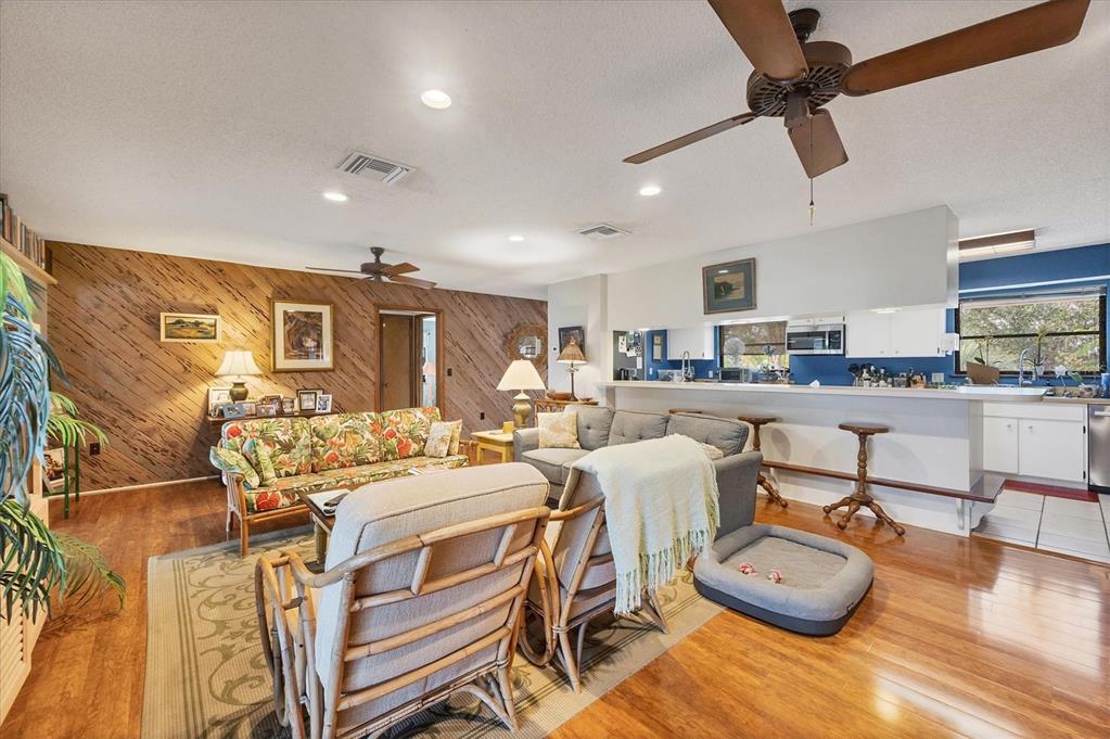 140 Damfino Street Boca Grande, FL 33921 - Photo 14 of 48 a living room with stainless steel appliances furniture and a kitchen view