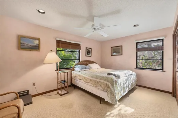 a bed room with a bed and a window