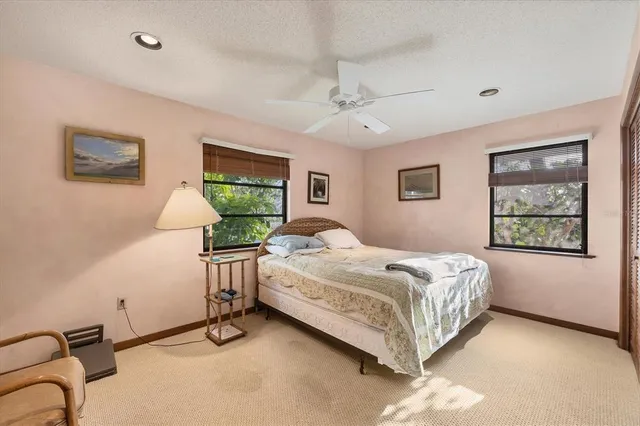 a bed room with a bed and a window