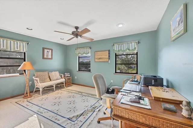 a living room with furniture a rug and a window