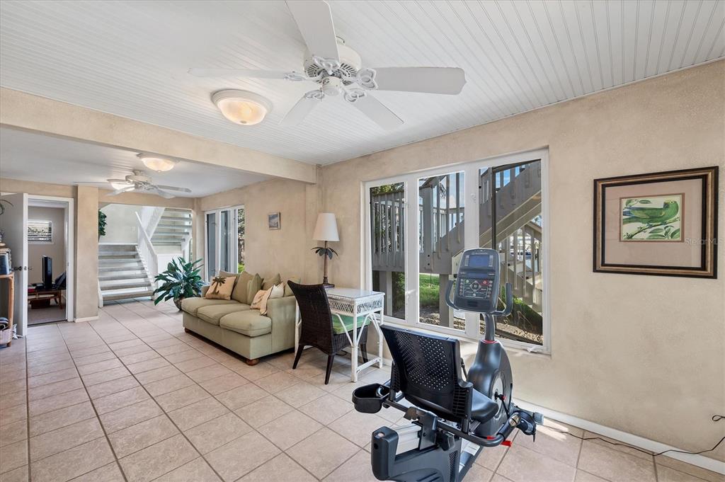 140 Damfino Street Boca Grande, FL 33921 - Photo 27 of 48 a view of a livingroom with workspace and a couch