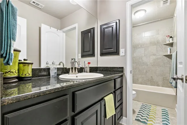 a view of a house with backyard sitting area and garden