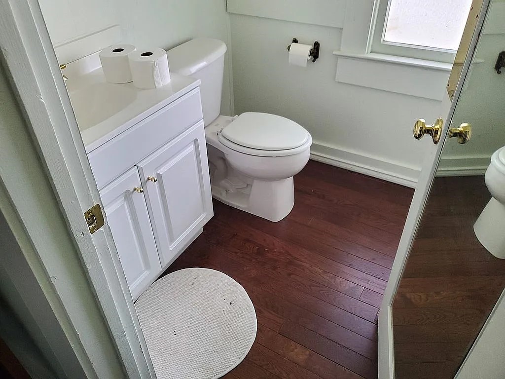 1102 Beech Street Taylor, TX 76574 - Photo 13 of 38 a bathroom with a toilet and a sink