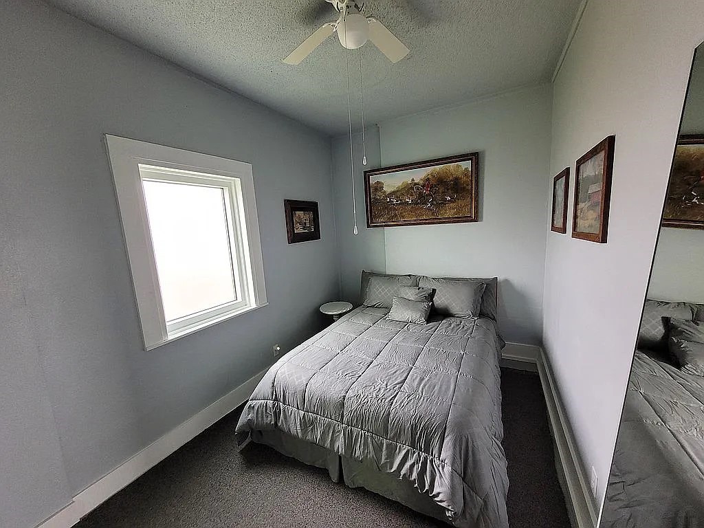 1102 Beech Street Taylor, TX 76574 - Photo 20 of 38 a bedroom with a bed and a window