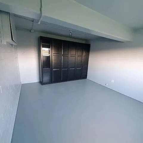 a bathroom with a double vanity sink a mirror and a bathtub