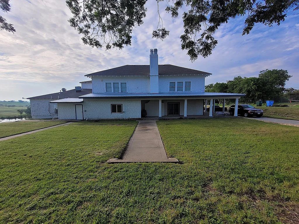 1102 Beech Street Taylor, TX 76574 - Photo 34 of 38 a front view of a house with a yard