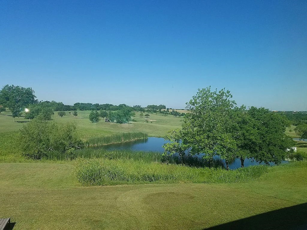 1102 Beech Street Taylor, TX 76574 - Photo 35 of 38 a view of lake with green space