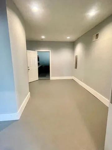 a kitchen with a refrigerator and a sink