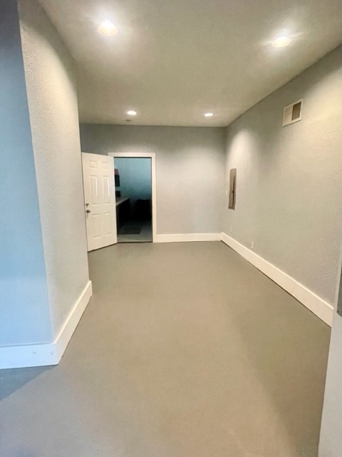 1102 Beech Street Taylor, TX 76574 - Photo 9 of 38 an empty room with a fireplace