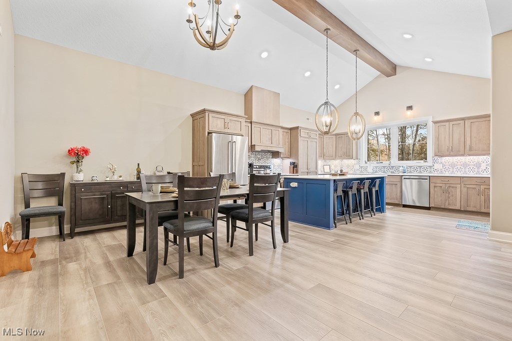 9340 Yale Road Diamond, OH 44412 - Photo 12 of 50 Dining area with beamed/vaulted ceiling open to the chef's entertaining kitchen