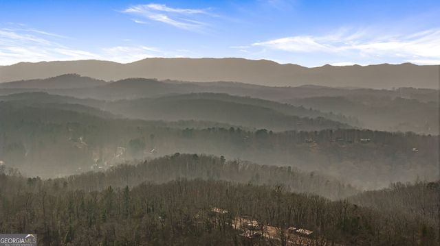 a view of a town with mountains in the background