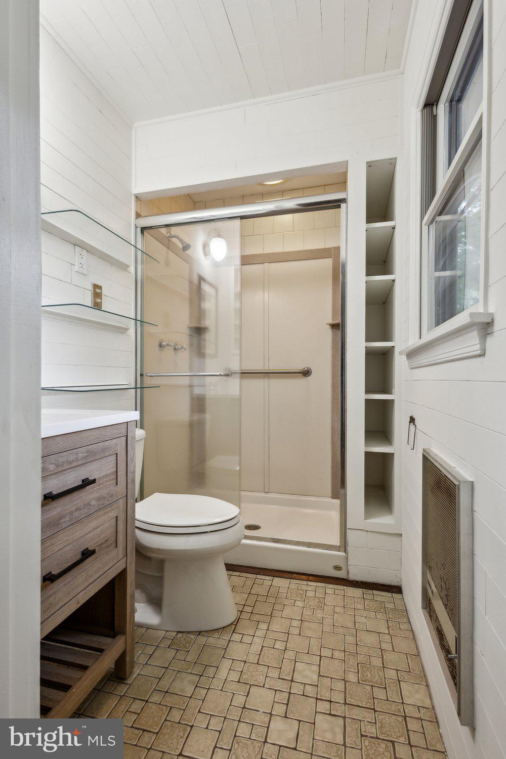 5936 River Drive Lorton, VA 22079 - Photo 12 of 19 a bathroom with a toilet and a shower