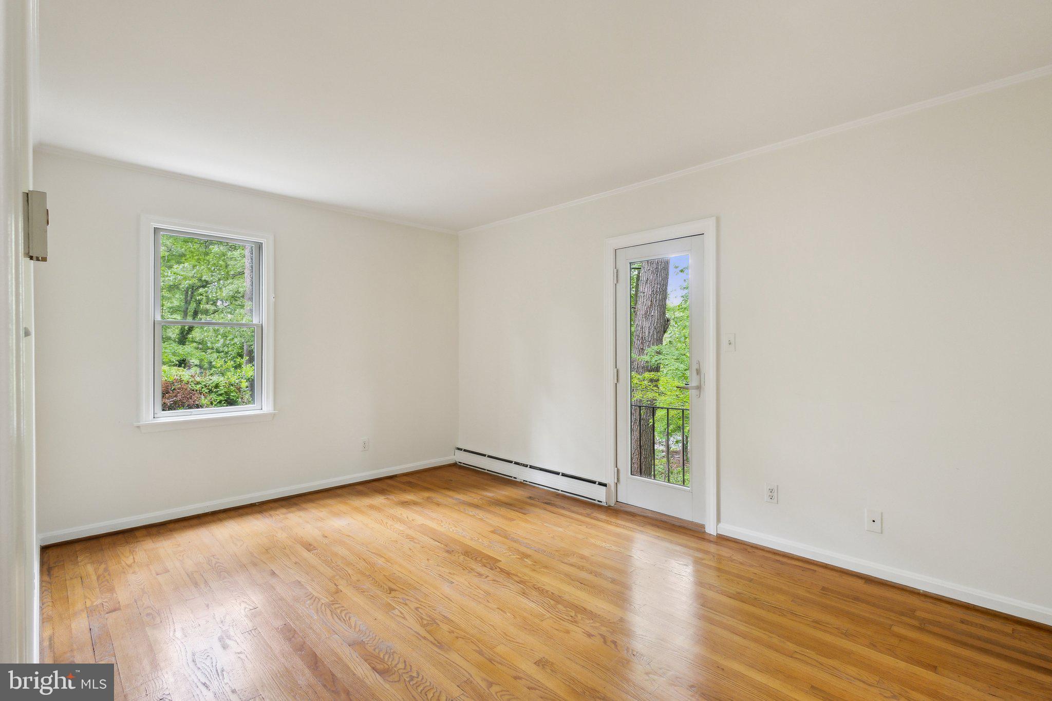 5936 River Drive Lorton, VA 22079 - Photo 14 of 19 an empty room with wooden floor and windows