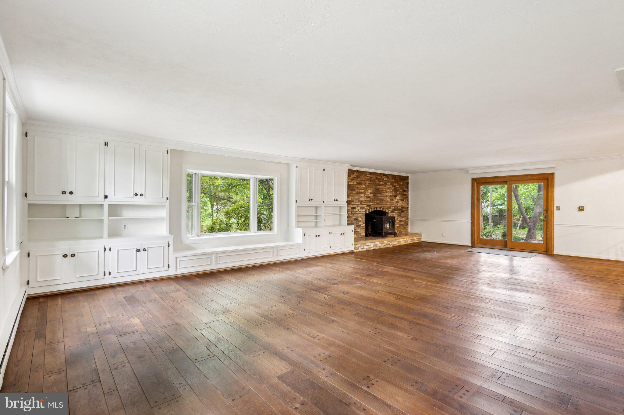 5936 River Drive Lorton, VA 22079 - Photo 5 of 19 an empty room with wooden floor and windows