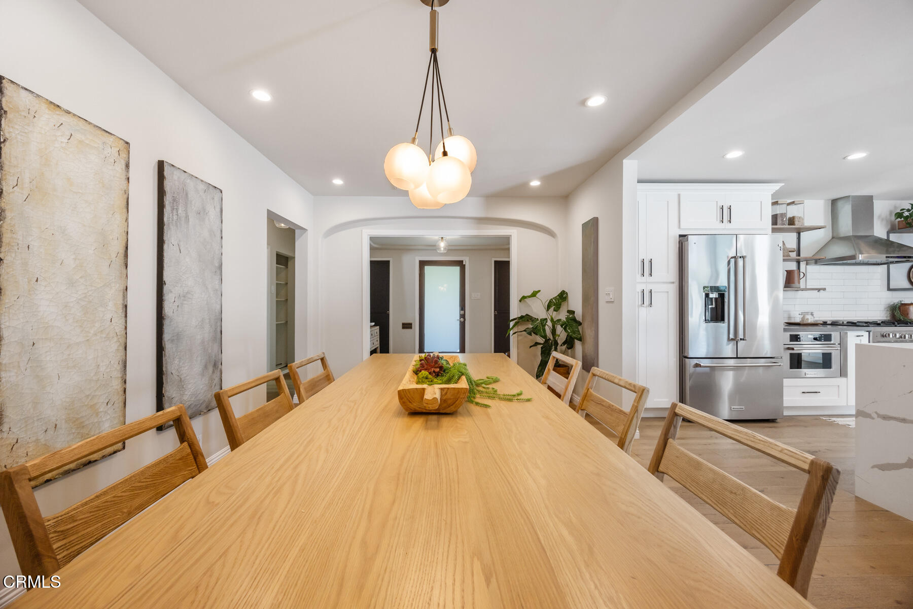 2386 Galbreth Road Pasadena, CA 91104 - Photo 16 of 63 a large white kitchen with stainless steel appliances lots of counter space and furniture