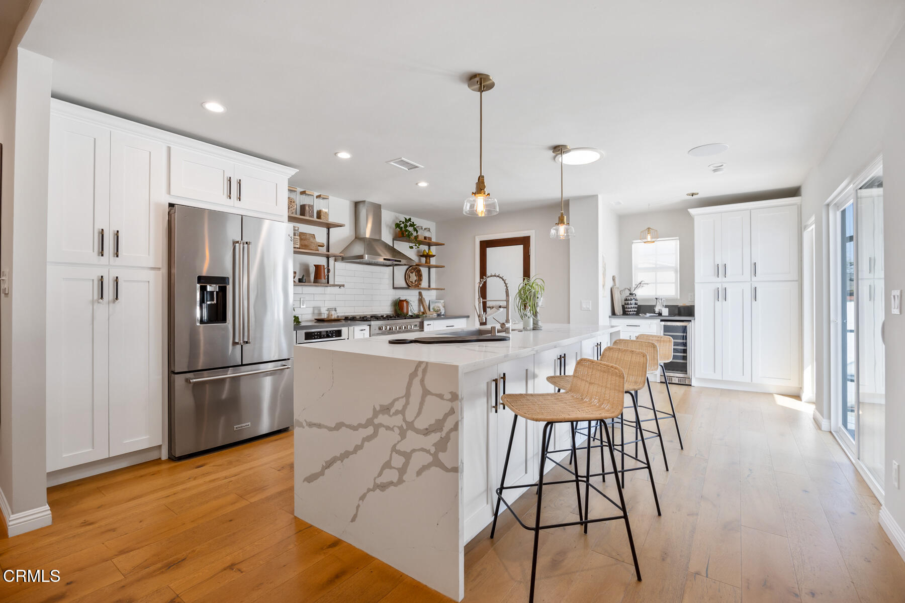 2386 Galbreth Road Pasadena, CA 91104 - Photo 17 of 63 a kitchen with stainless steel appliances granite countertop a refrigerator a oven a sink and white cabinets with wooden floor