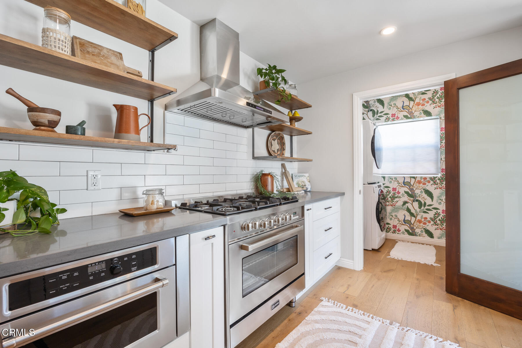 2386 Galbreth Road Pasadena, CA 91104 - Photo 20 of 63 a kitchen with stainless steel appliances granite countertop a stove and a sink