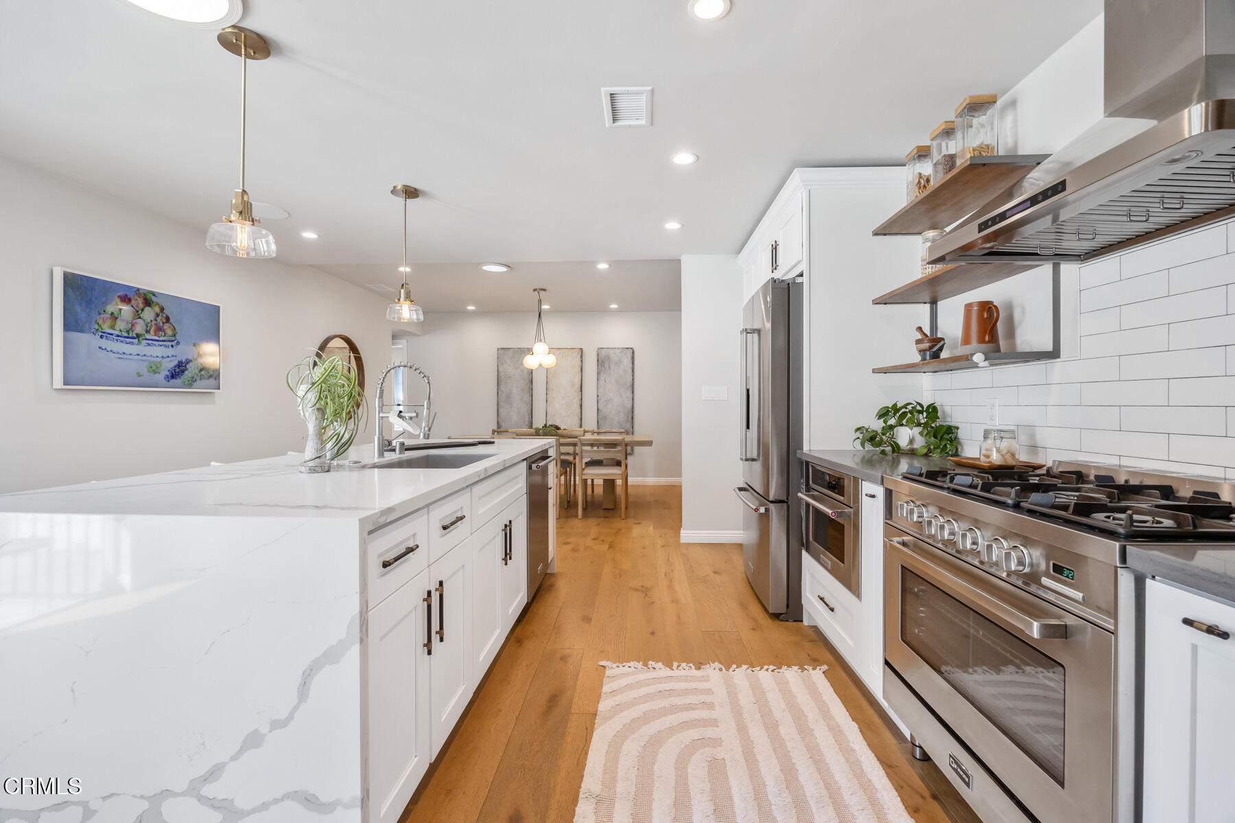 2386 Galbreth Road Pasadena, CA 91104 - Photo 22 of 63 a large kitchen with stainless steel appliances granite countertop a stove and a sink