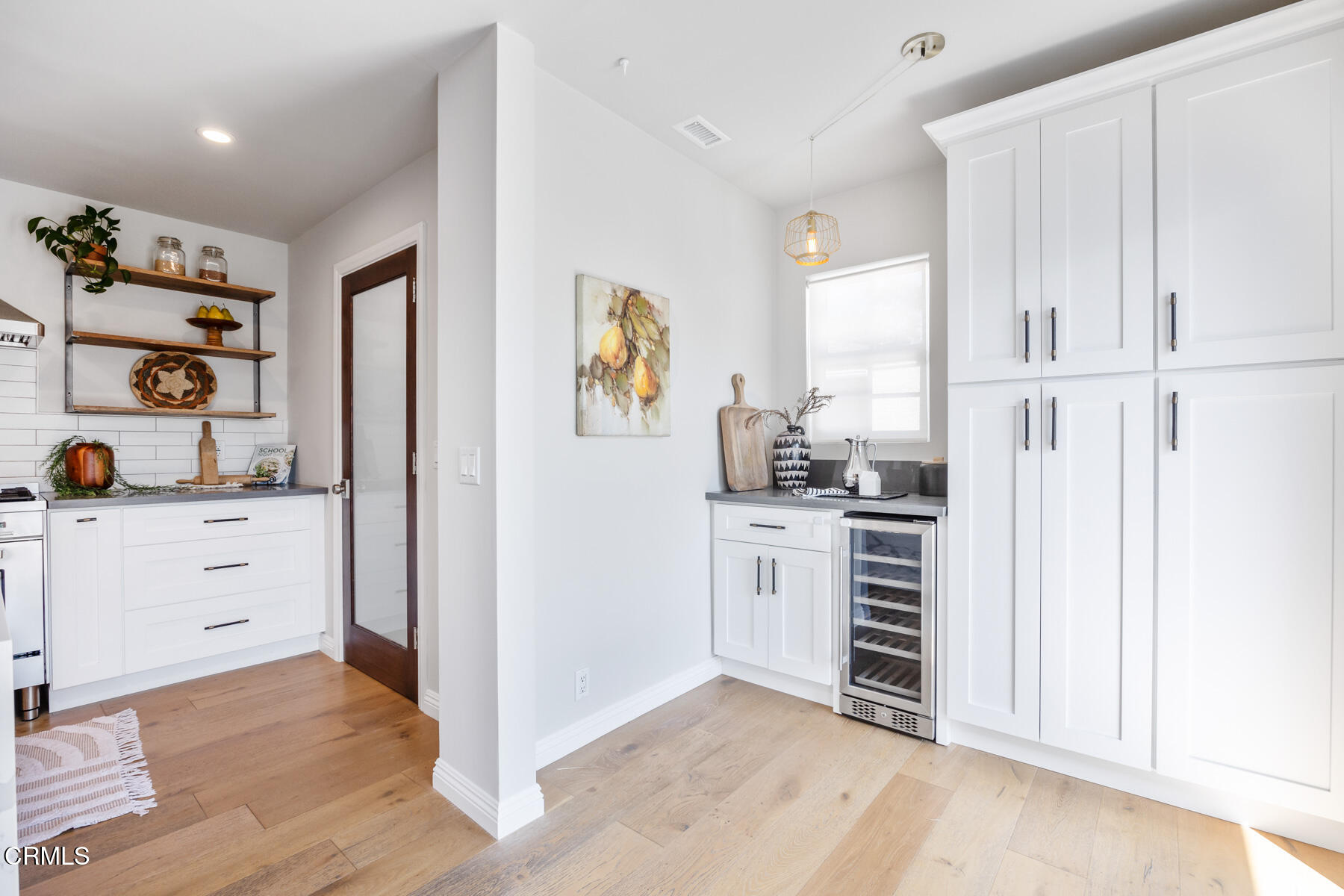 2386 Galbreth Road Pasadena, CA 91104 - Photo 24 of 63 a kitchen with white cabinets and window