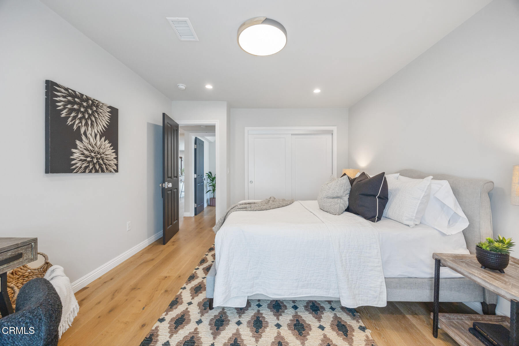 2386 Galbreth Road Pasadena, CA 91104 - Photo 27 of 63 a bedroom with a large bed and a chandelier