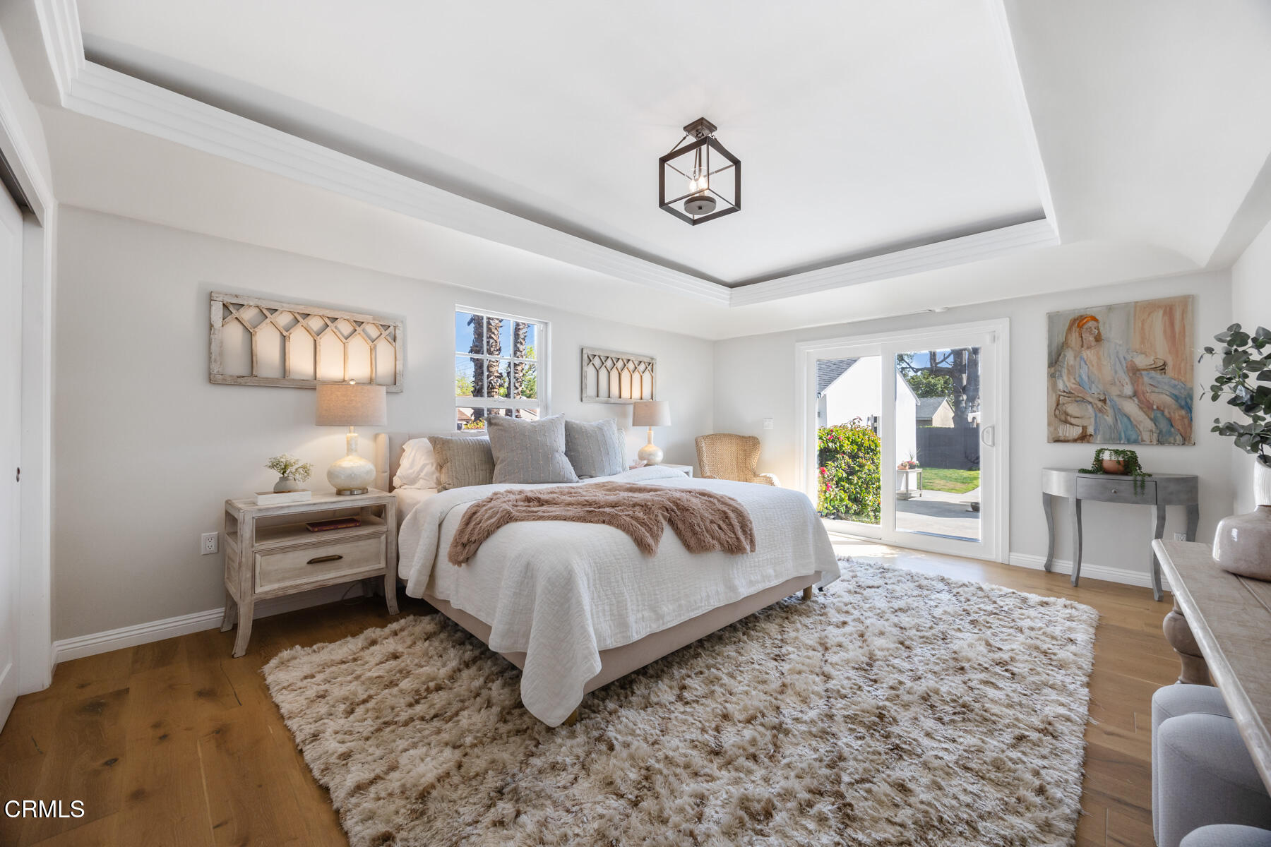 2386 Galbreth Road Pasadena, CA 91104 - Photo 30 of 63 a spacious bedroom with a bed a couch and a large window