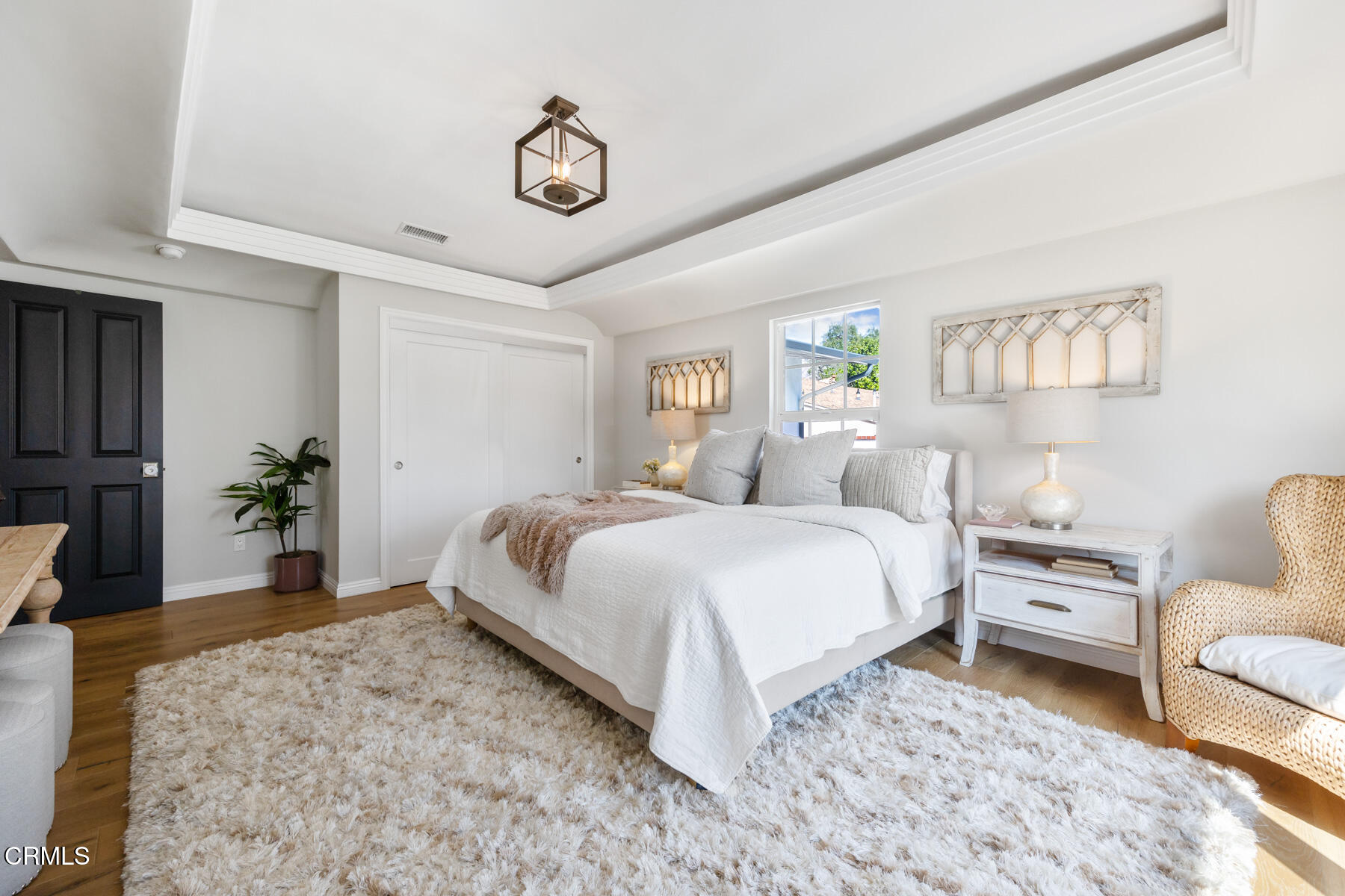 2386 Galbreth Road Pasadena, CA 91104 - Photo 31 of 63 a bedroom with a bed a couch and a potted plant