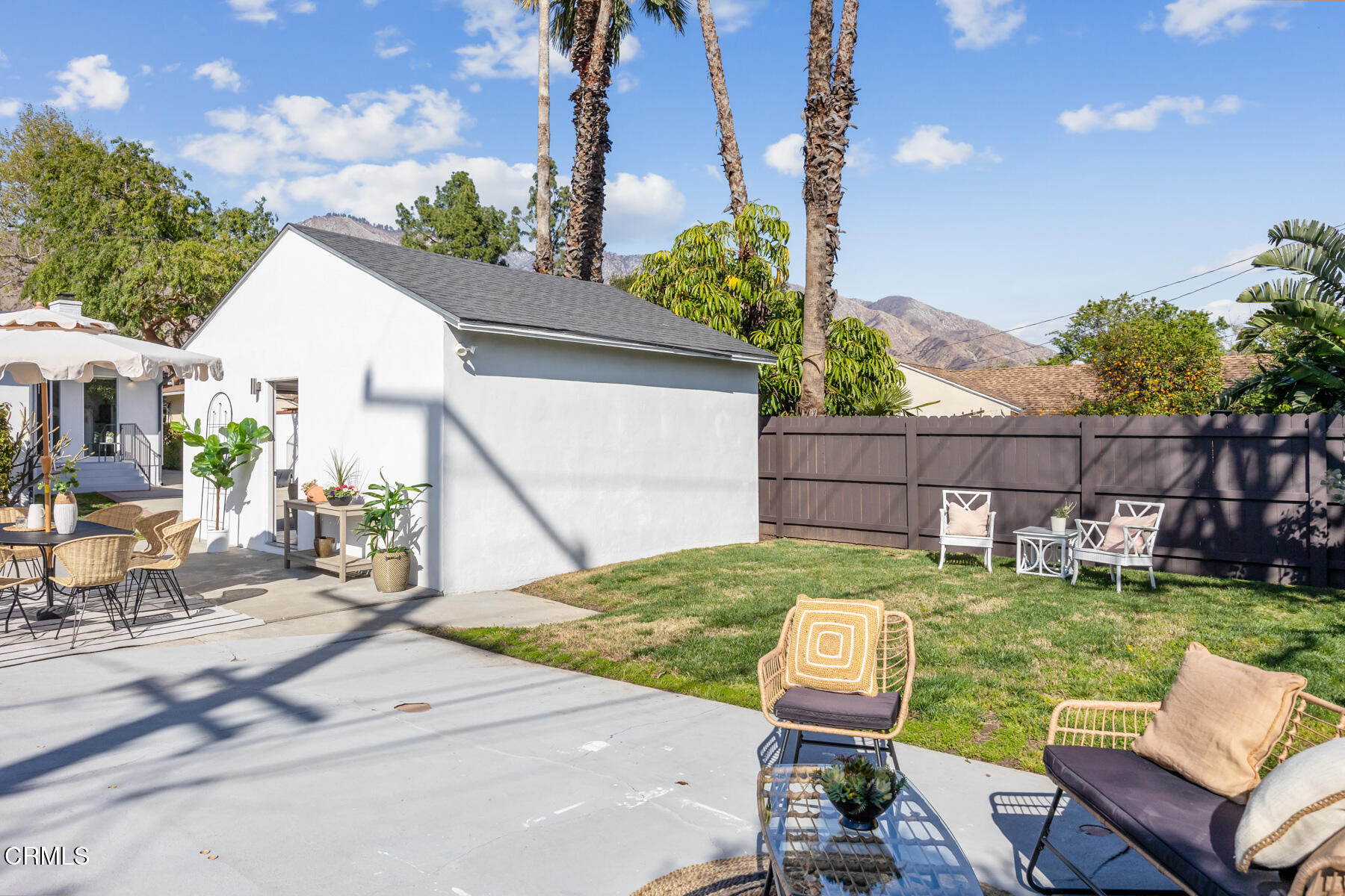2386 Galbreth Road Pasadena, CA 91104 - Photo 50 of 63 a view of a backyard with couches plants and wooden fence