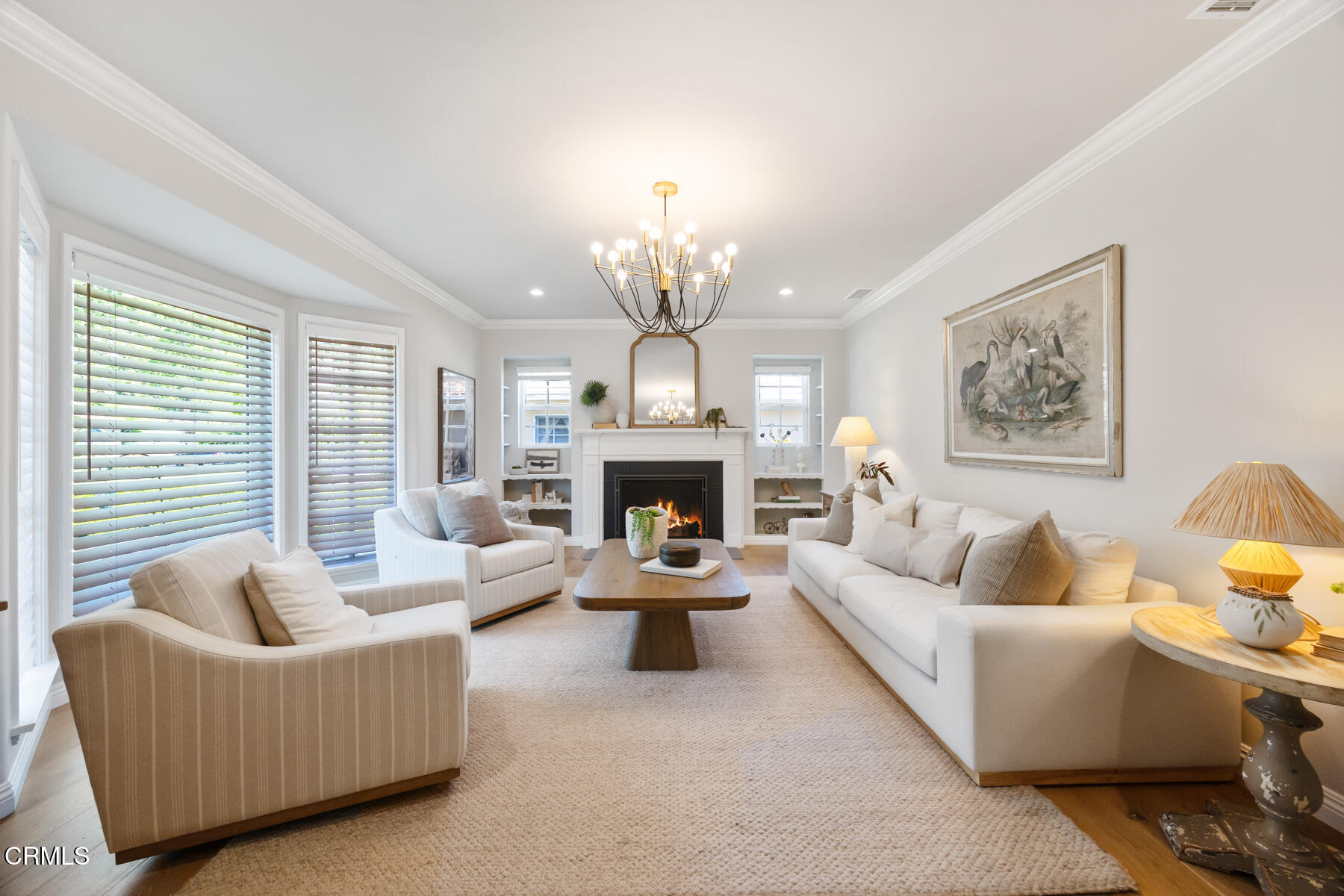 2386 Galbreth Road Pasadena, CA 91104 - Photo 9 of 63 a living room with furniture a fireplace and a chandelier