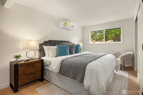 a bedroom with a bed and window