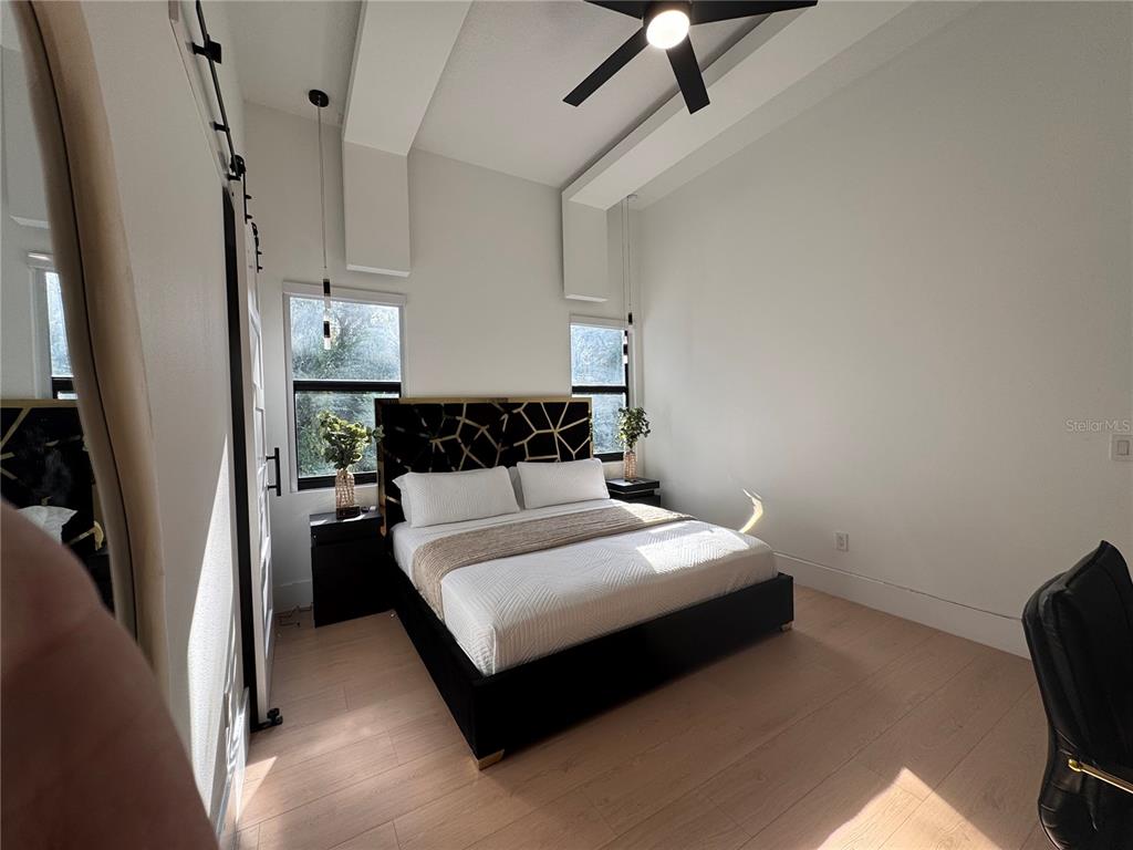 17314 Highway 41 Spring Hill, FL 34610 - Photo 35 of 54 a bedroom with a bed and a chair