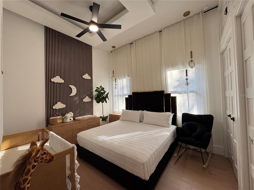 17314 Highway 41 Spring Hill, FL 34610 - Photo 38 of 54 a bedroom with a bed and a table in it