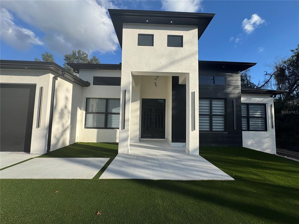 17314 Highway 41 Spring Hill, FL 34610 - Photo 47 of 54 a front view of a house with a yard