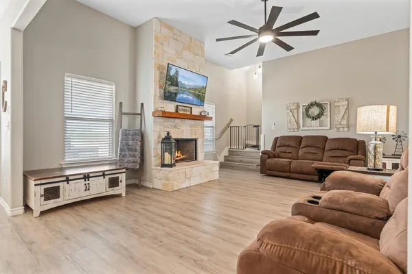 a dining room with furniture and wooden floor