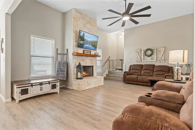 a dining room with furniture and wooden floor